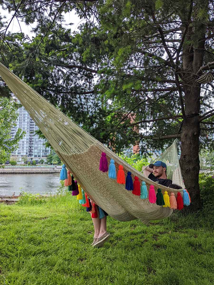 Hammock with outlet tassels